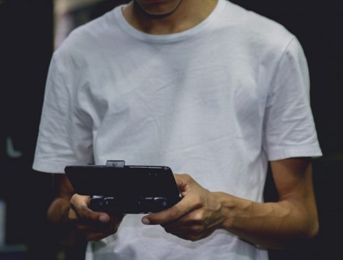 a-smartphone-game-controller-on-a-person-s-hand-2883029